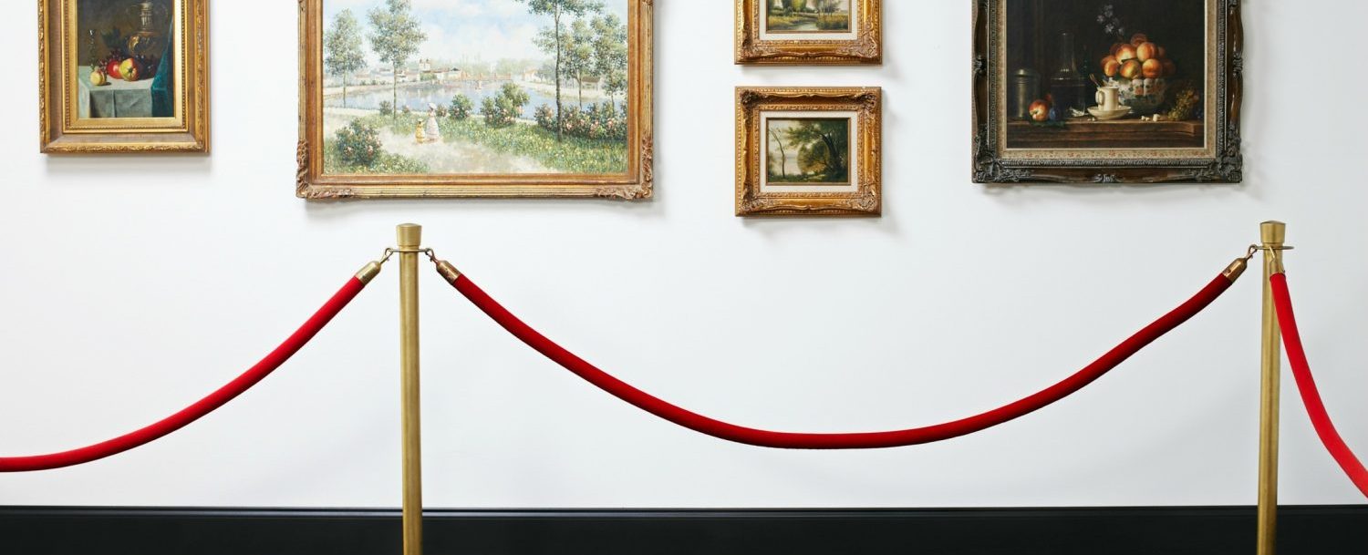 Museum of the Shenandoah Valley | Five paintings on a white wall with red velvet ropes keeping them safe
