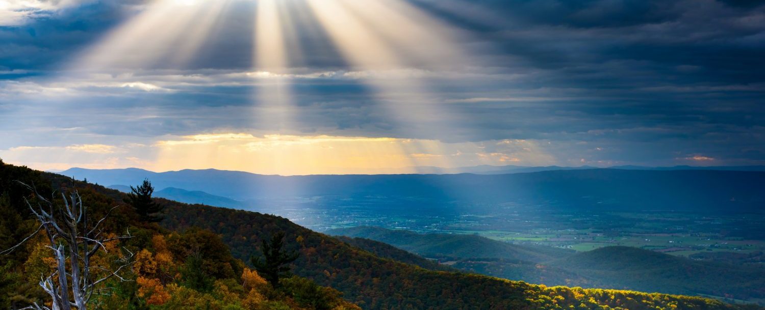 Weekend Getaways from Maryland | Sunrays peeking through the clouds above the Blue Ridge Mountains